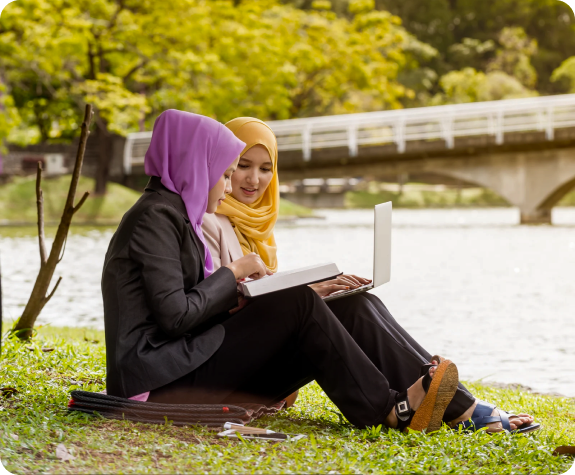 Students studying outdoors on campus