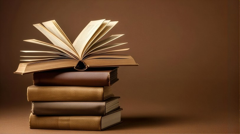 Open book on a stack of books